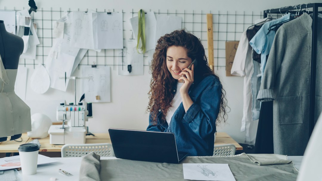 Local business owner using a phone and laptop